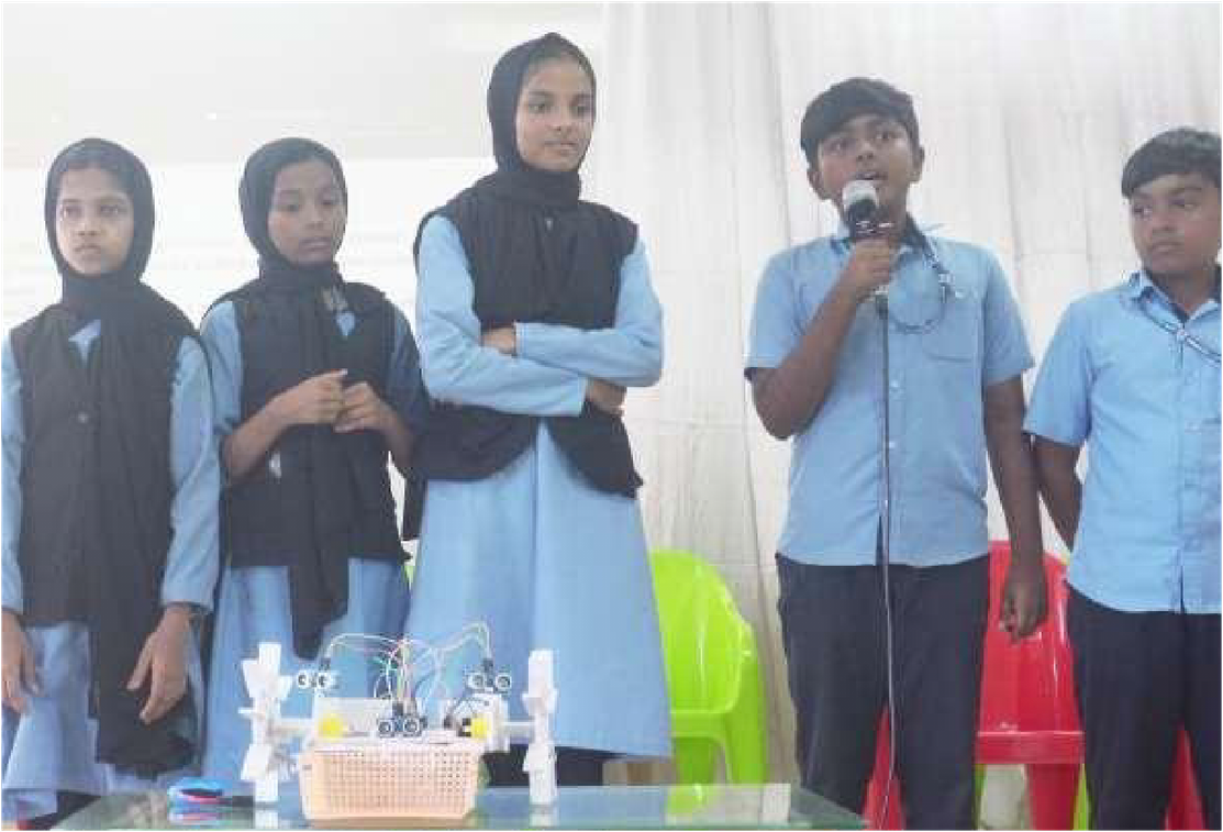 Students presenting a robotics project at the district expo