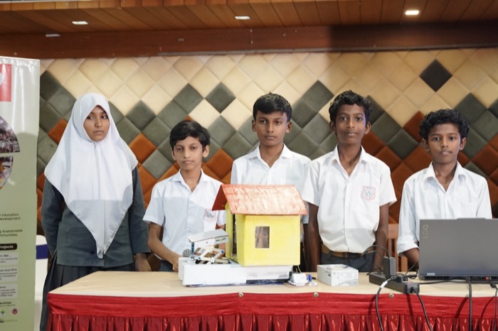 Students presenting the Life Guard hydraulic house project